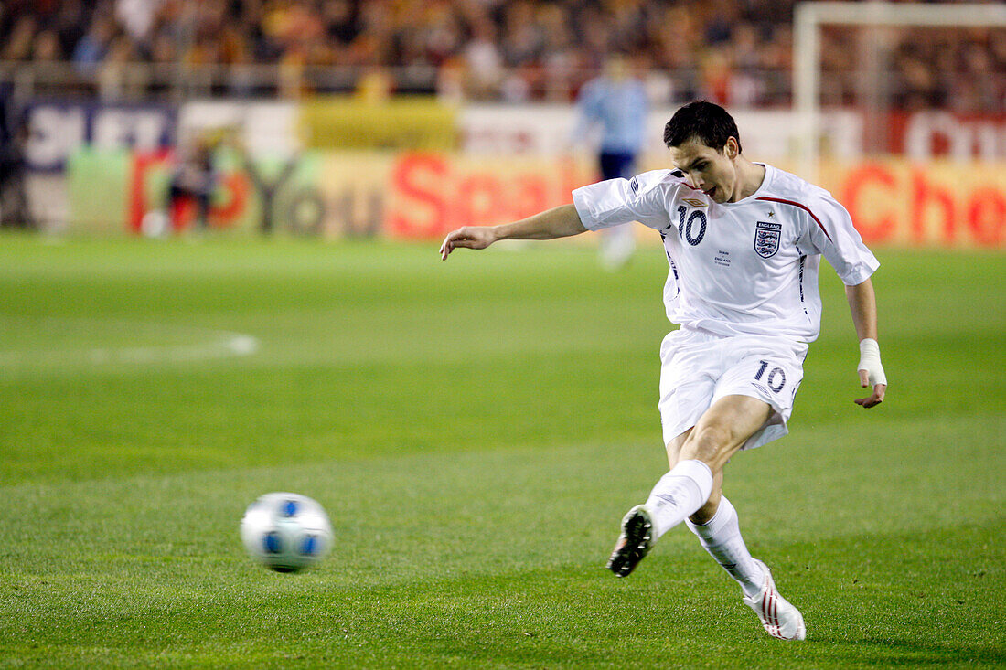 Seville, Spain, Feb 11 2009, Stewart Downing makes a powerful kick during a friendly match in Sevilla on February 11, 2009, showcasing his soccer skills.