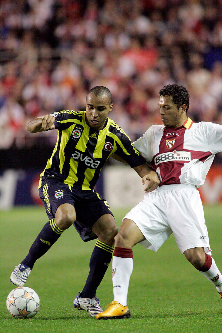 Seville, Spain, March 4 2008, Fenerbahçes Deivid and Sevillas Adriano battle for possession during a Champions League knockout match in Sánchez Pizjuán stadium.