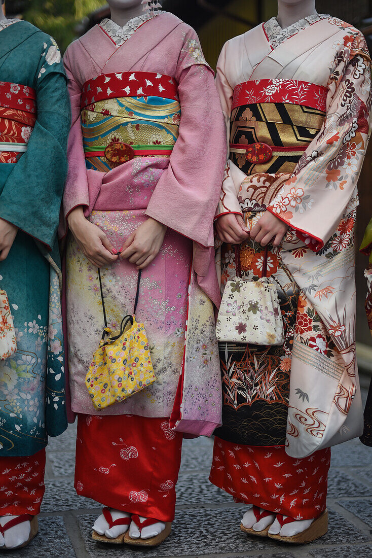 Group of women dressed as Maikos in the streets of Kyoto, Japan