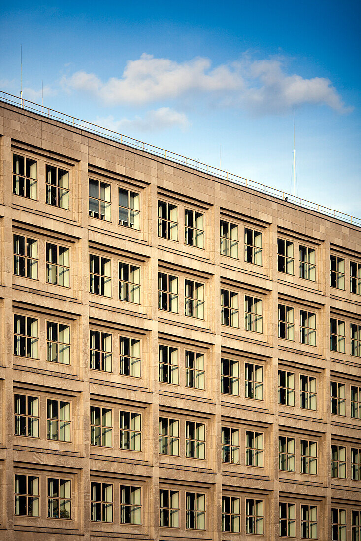 The historic architecture of a building in Alexanderplatz showcases its unique design in Berlin under a clear blue sky.