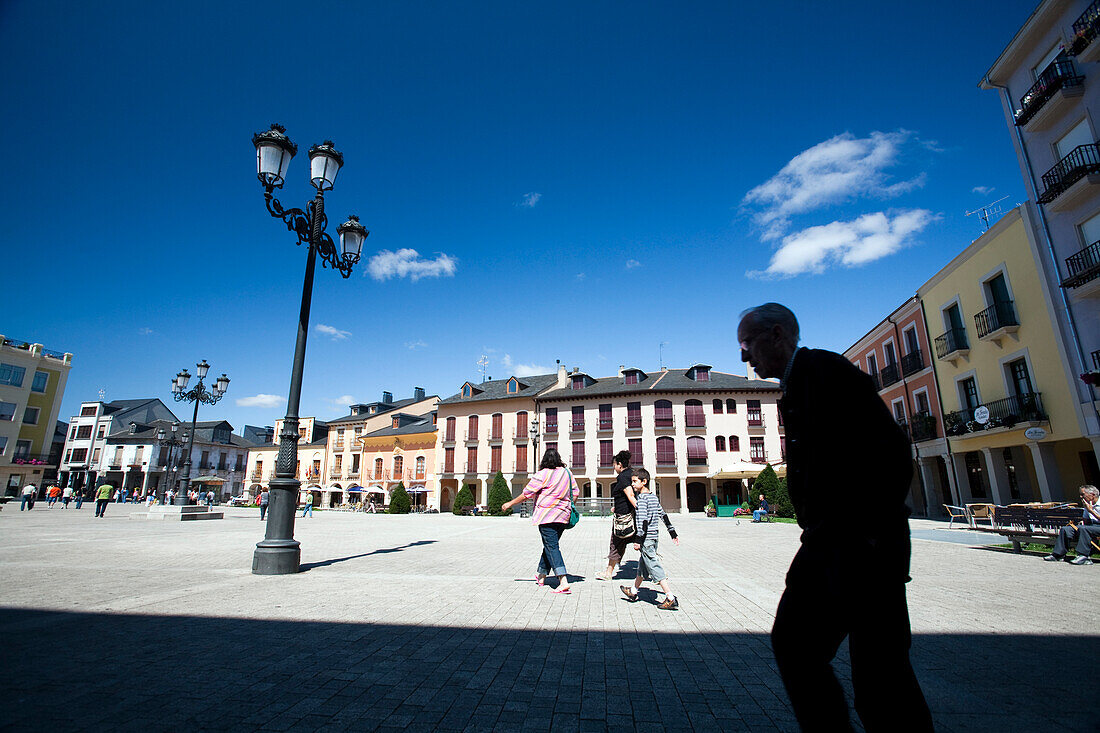 Ponferrada, Spain, Aug 19 2008, Visitors enjoy a sunny day in Plaza Mayor de Ponferrada with vibrant buildings and clear blue skies overhead.