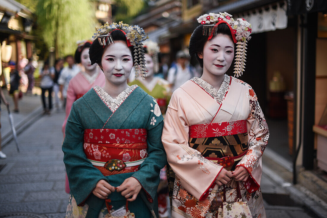 Group of women dressed as Maikos in the streets of Kyoto, Japan