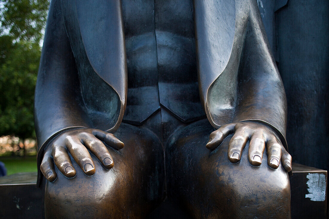 The statue of Karl Marx displays its hands, a symbol of his contributions to communist thought, located in Berlin\'s Mitte district.