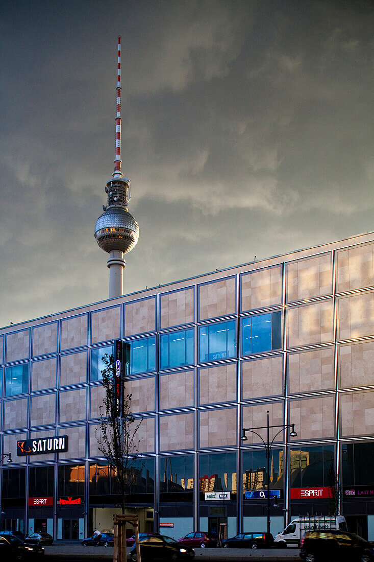 Berlin, Germany, July 24 2009, The distinctive Fernsehturm towers over Alexander street, showcasing Berlin\'s vibrant architecture and urban atmosphere.