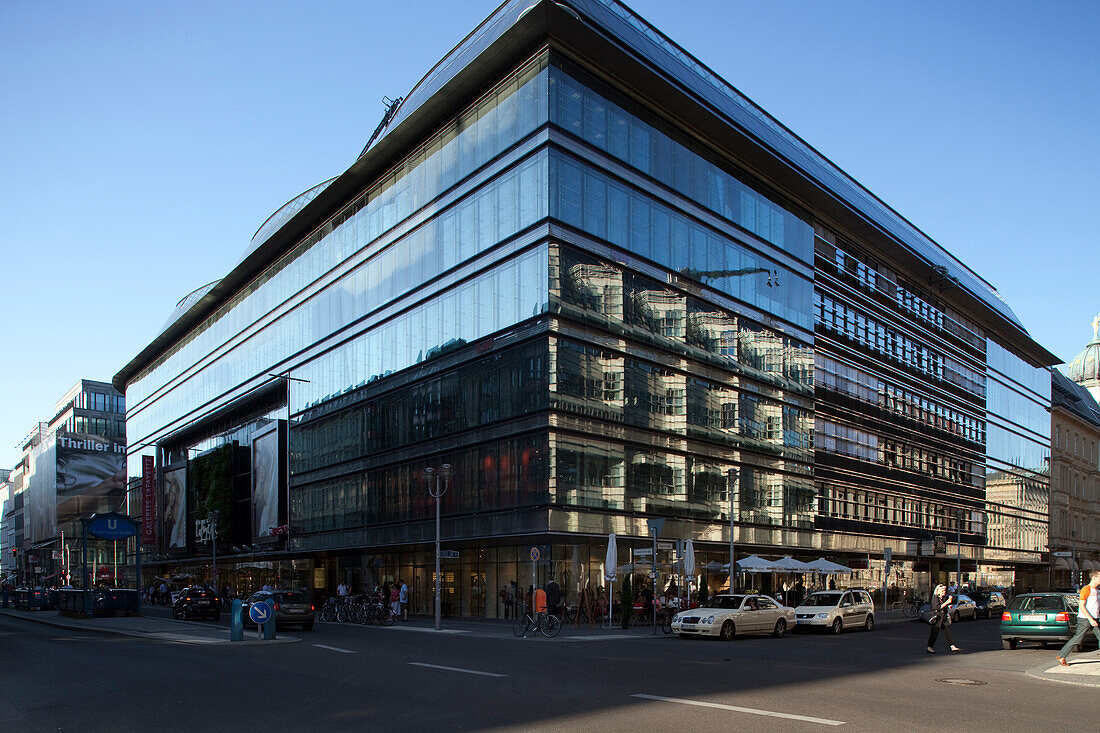 A striking contemporary building showcases glass facades at the corner of Friedrichstrasse and Jägerstrasse in Berlin’s Mitte district.