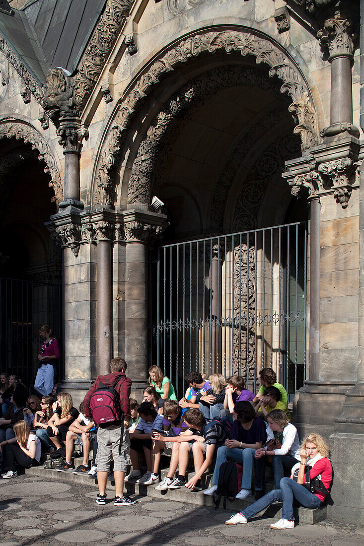 Berlin, Germany, July 24 2009, People gather at the historic Kaiser Wilhelm Memorial Church, a poignant reminder of war\'s impact in Berlin.