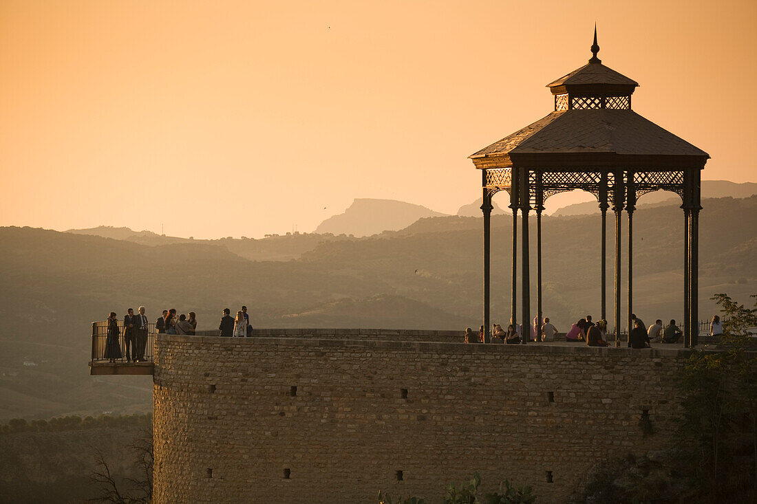 Ronda, Spain, Sep 22 2007, Visitors gather at the bandstand in Ronda, enjoying the stunning sunset views over El Tajo gorge and the surrounding landscapes.