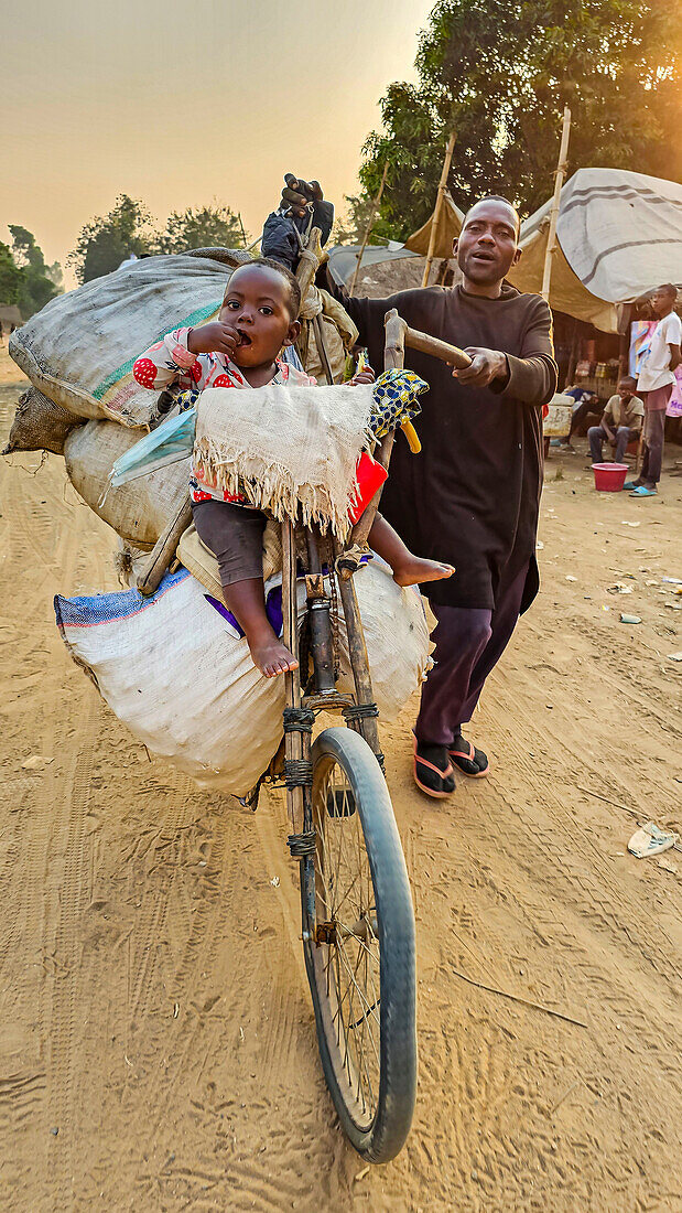 Man with a loaded bicycle on the very bad road between Tshikapa and Kananga, Kasai, Democratic Republic of Congo, Africa