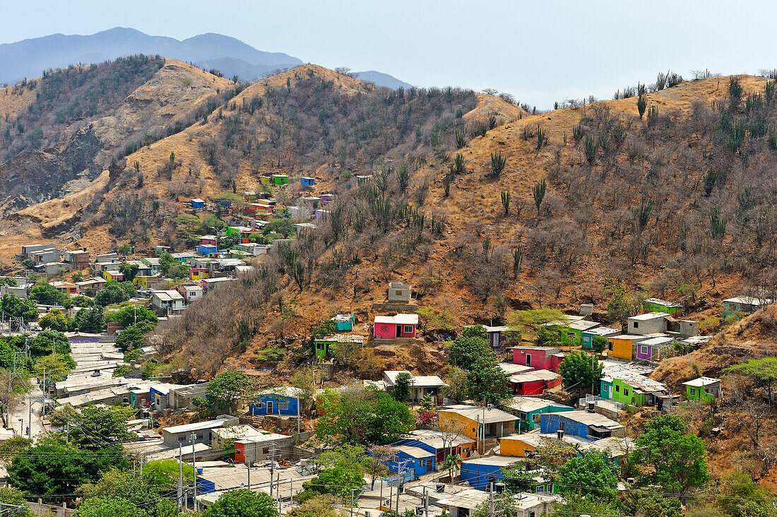 Colorful houses in a poor area on the hillside around Santa Marta, department of Magdalena, Caribbean Region, Colombia, South America