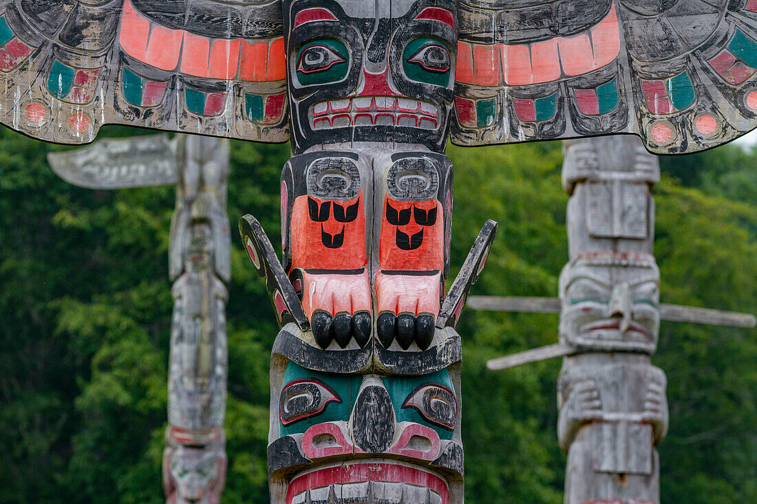 Totem poles in the cemetery of the First Nations Kwakwaka'wakw people in Alert Bay, British Columbia, Canada, North America