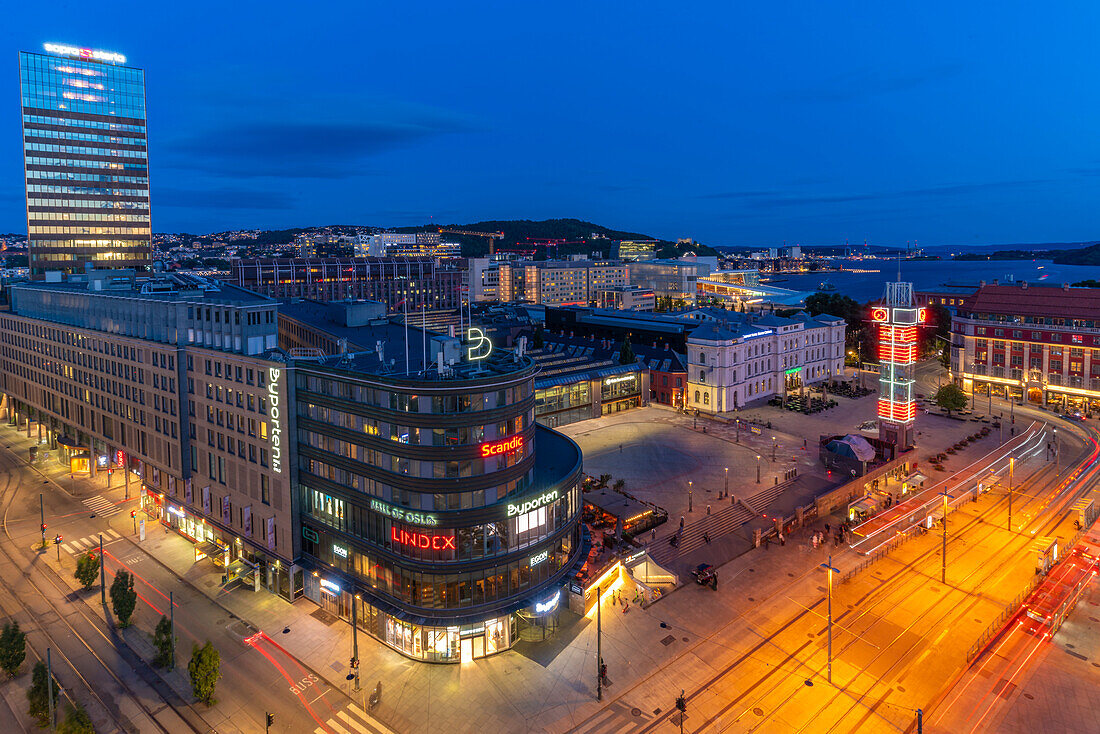 View of Jernbanetorget and city skyline from elevated position at dusk, Oslo, Norway, Scandinavia, Europe