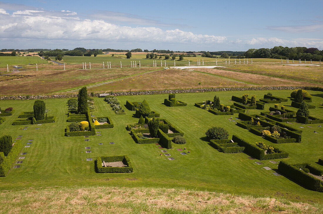 View from North mound of graveyard palisade and beyond monument area, Jelling, UNESCO World Heritage Site, Denmark, Europe