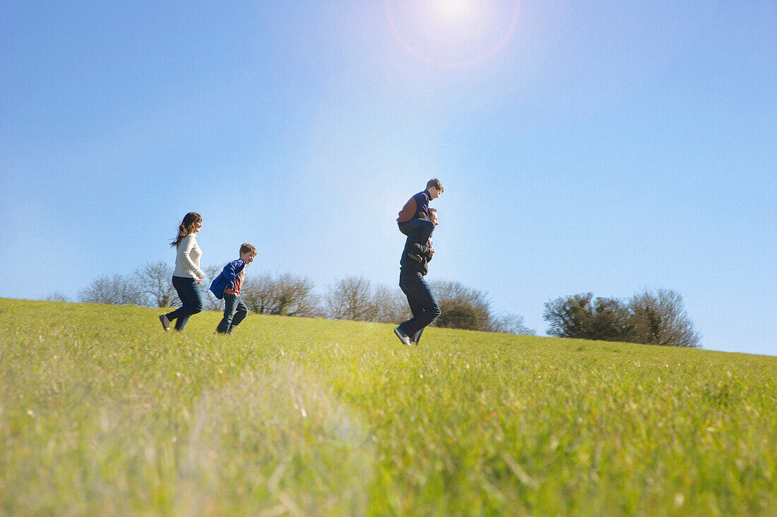 Family Running on Field