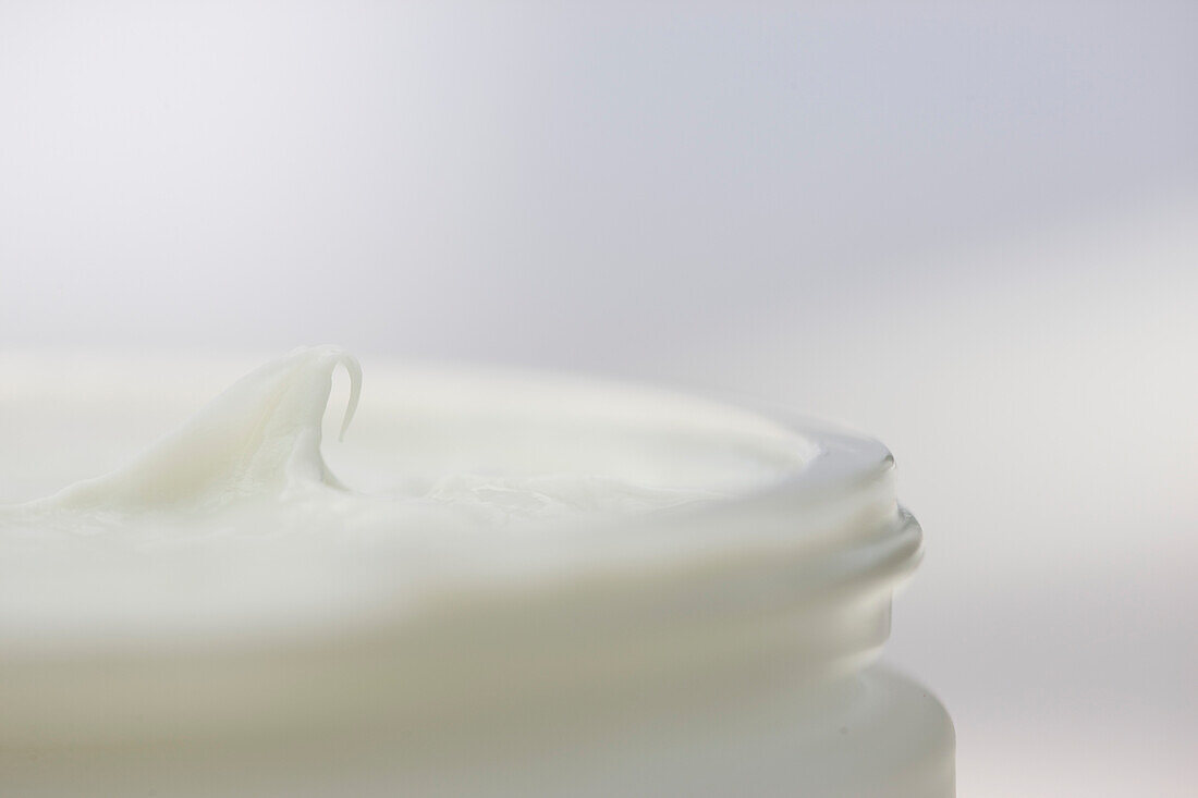 Close up of a jar full of moisturizer