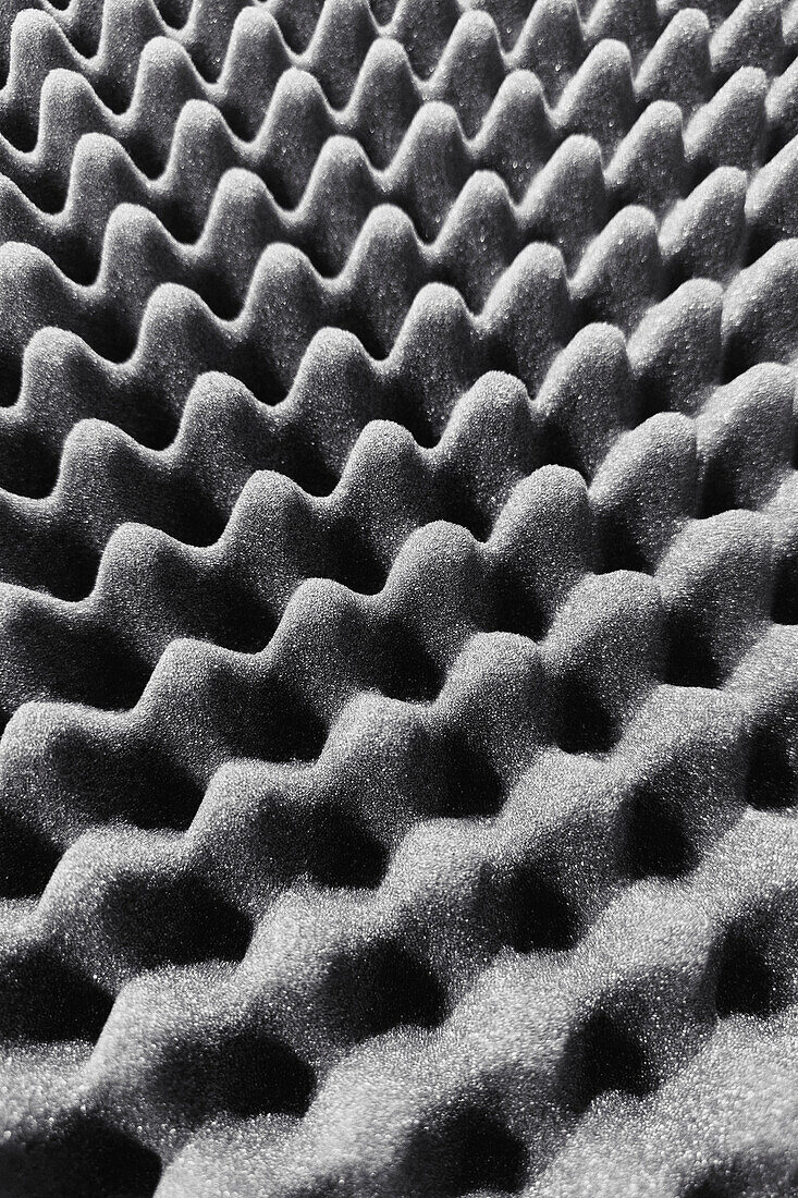 Close up full frame textured gray acoustic foam