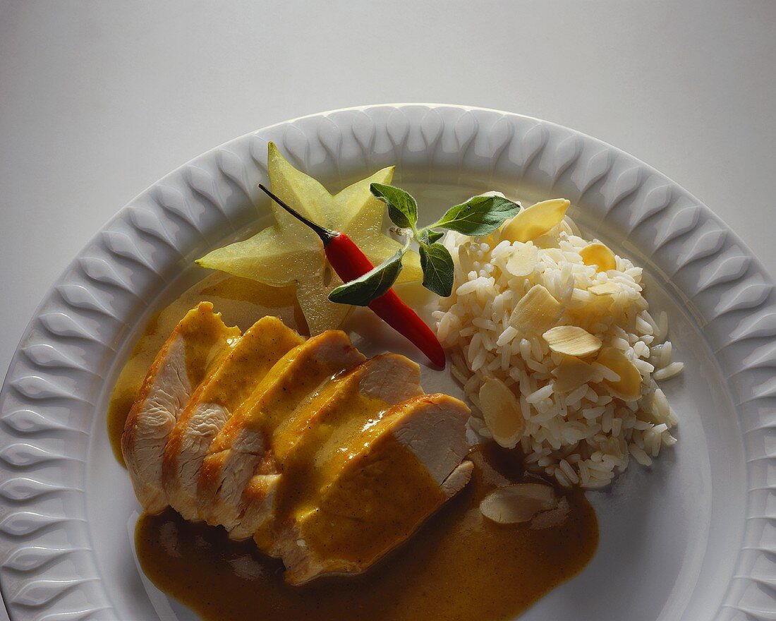 Chicken breast with curry sauce and almond rice