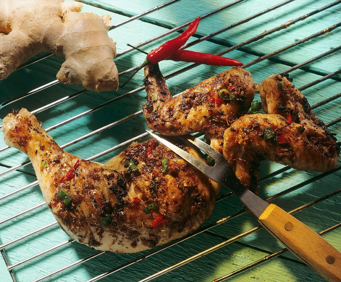 Marinated grilled chicken on grill rack