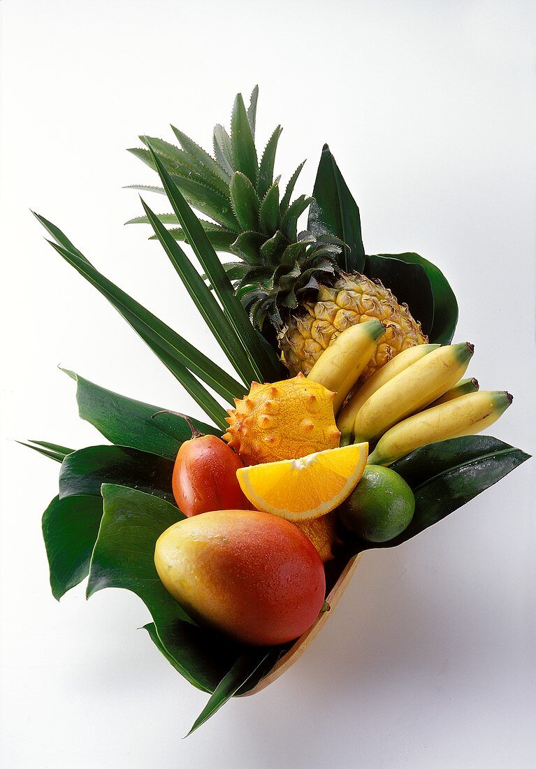 Various exotic fruits on leaves