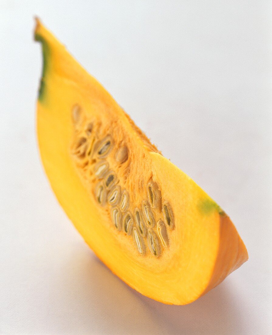 Segment of giant pumpkin on white background