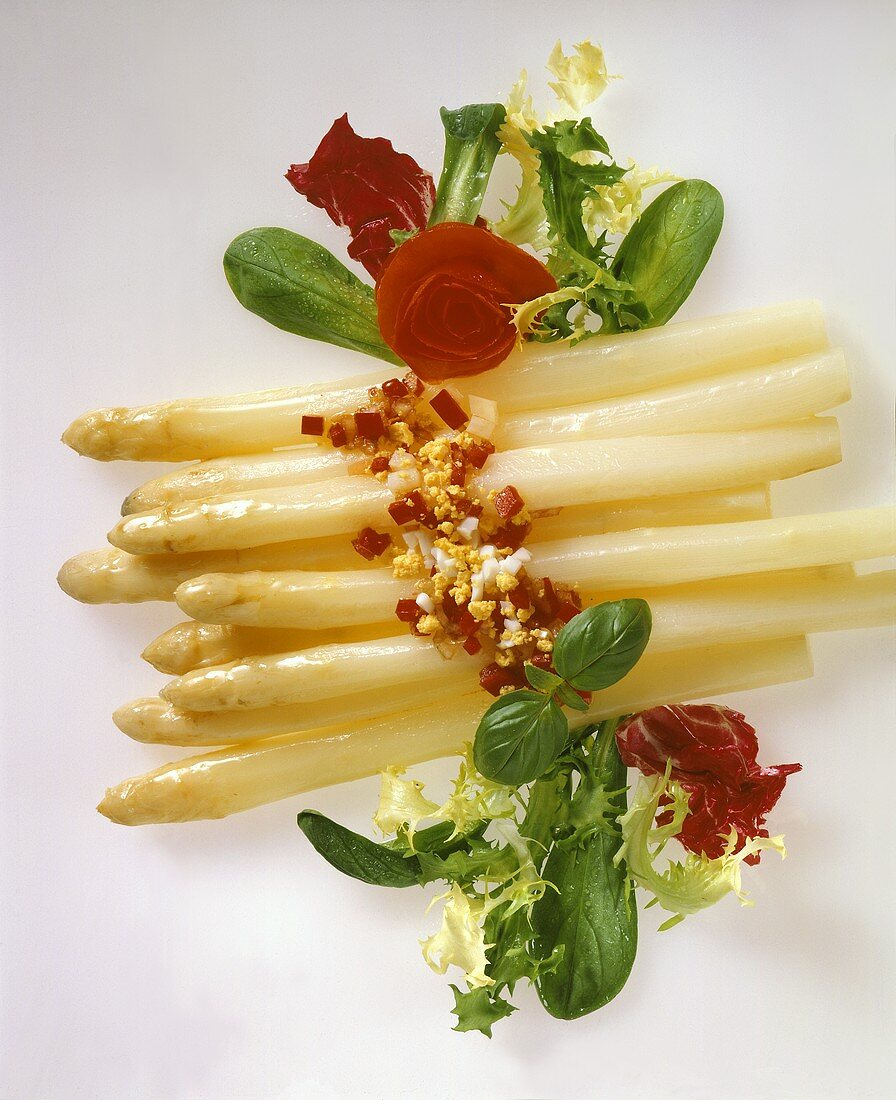 White asparagus with pepper & egg vinaigrette & salad leaves