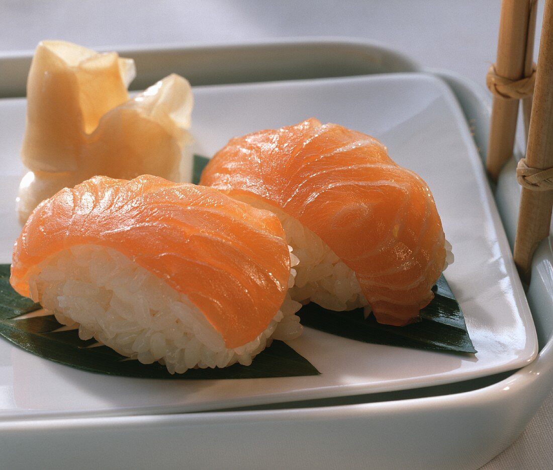 Two hand-formed salmon sushi