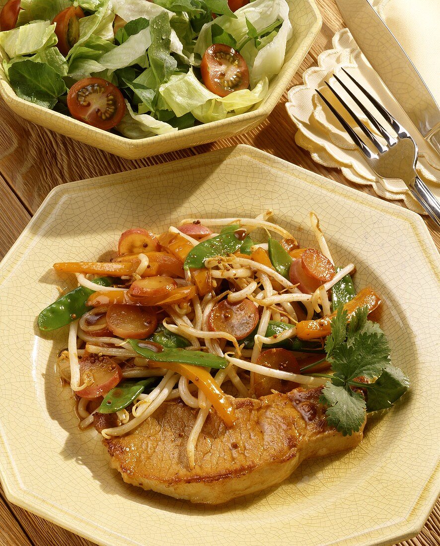 Pork chop with roast vegetables and beansprouts