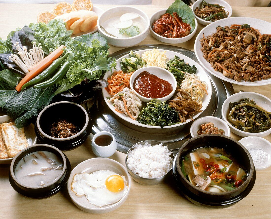 Large arrangement of various Korean dishes