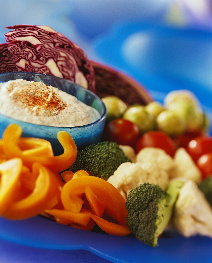 Raw vegetable pieces and a bowl of dip