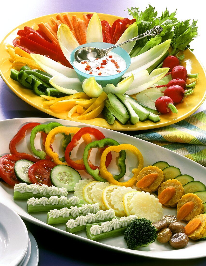 A platter of crudités and a platter of cold vegetables