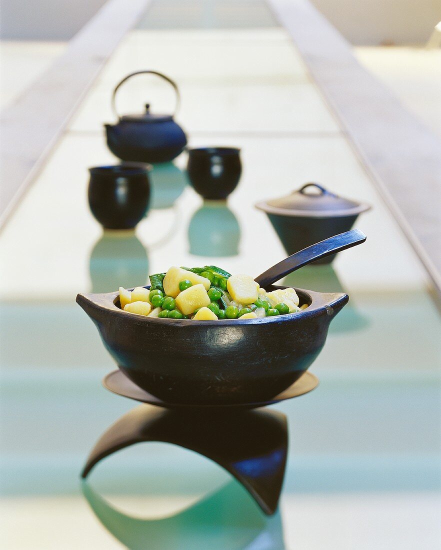 Pea and potato casserole in Asian bowl