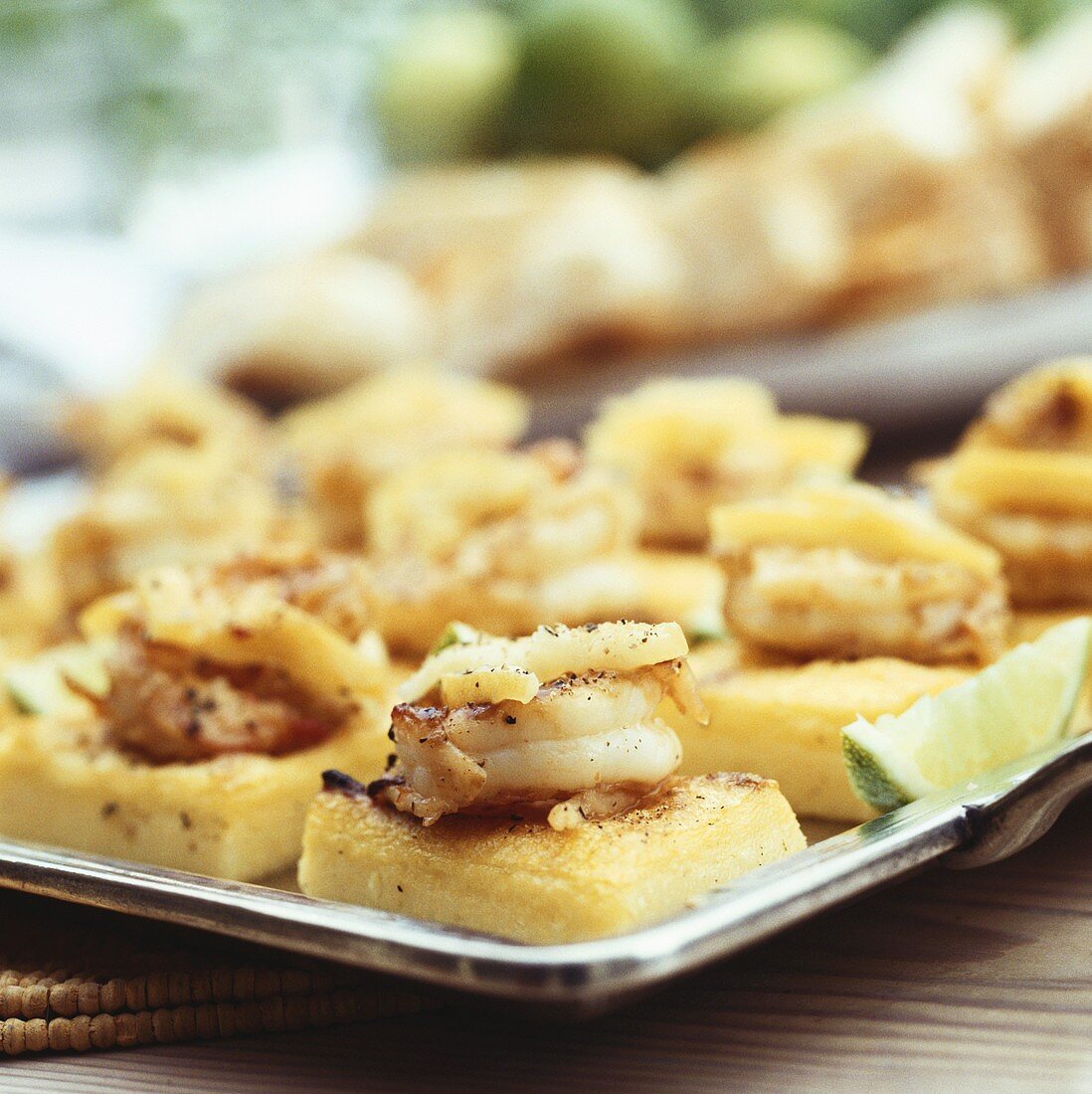 Pasticcini polenta e scampi (Shrimps on fried polenta)