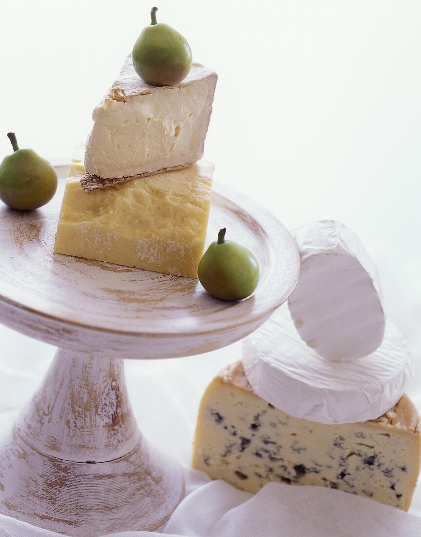 Cheese still life with various types of cheese & three pears