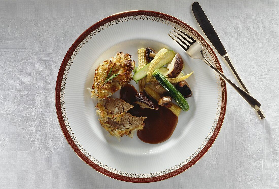 Lamb fillet with potato crust and vegetables