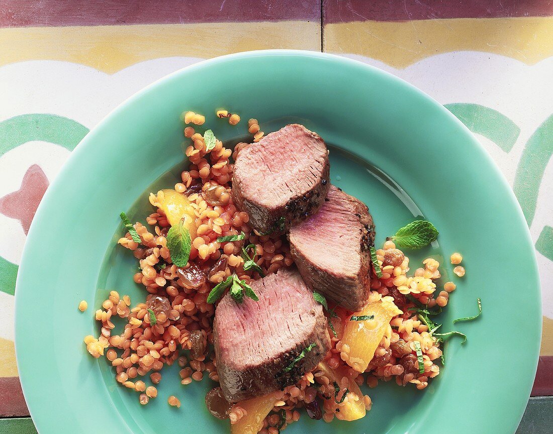 Lamb fillet on red lentils