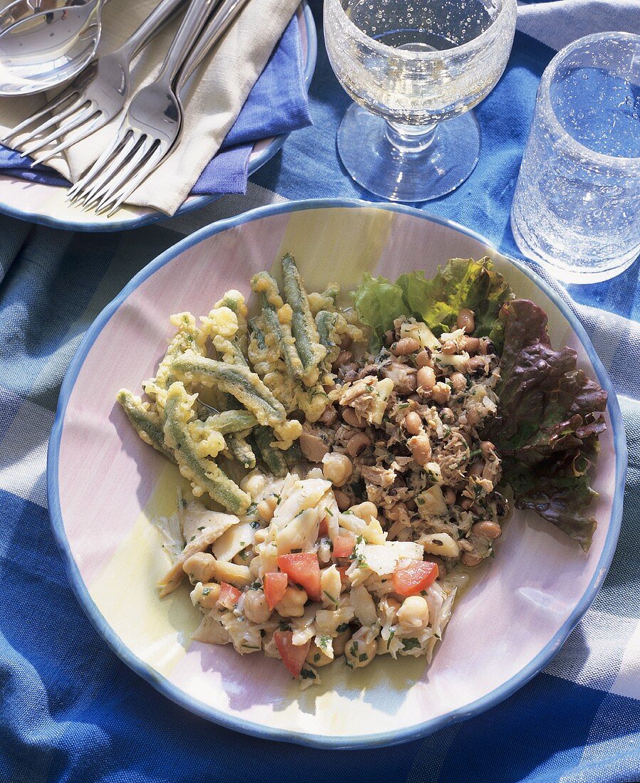 Plate of Portuguese appetisers with bean salads