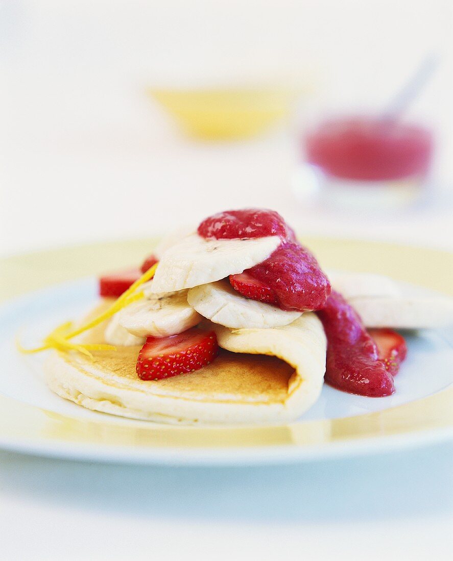 Pancake with banana and strawberry filling