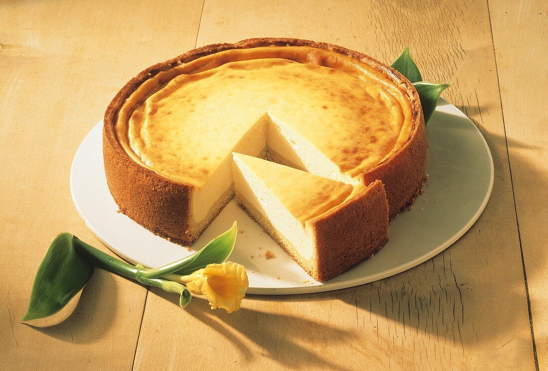 A cheesecake with a piece cut