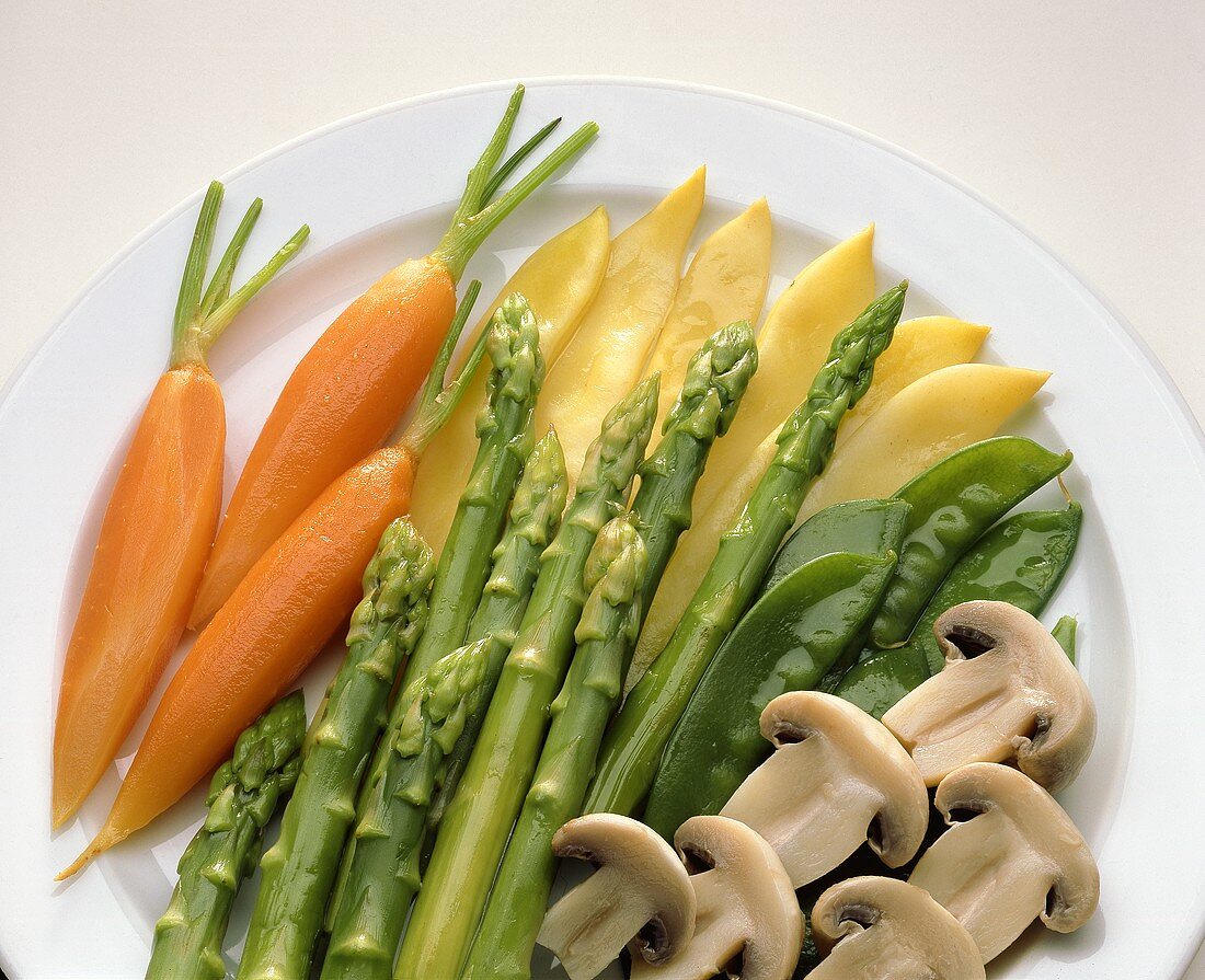Plate of blanched vegetables: carrots, asparagus, mushrooms etc