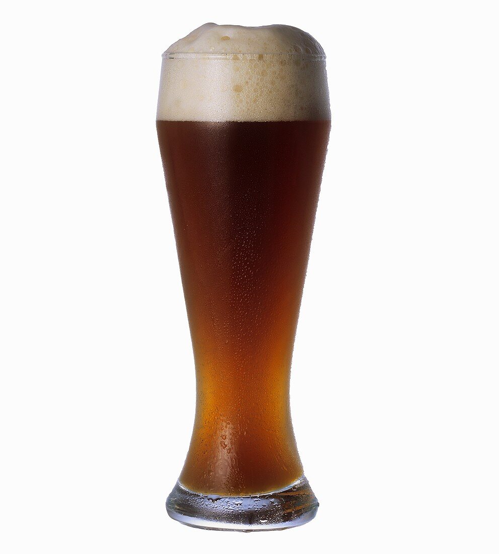 A glass of wheat beer with a head