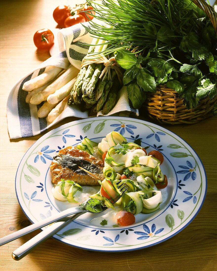 Saltimbocca with asparagus and tomato salad