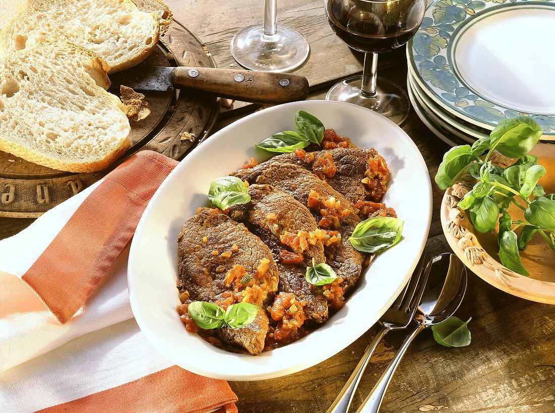 Bistecca alla pizzaiola (beef steaks with tomato sauce)