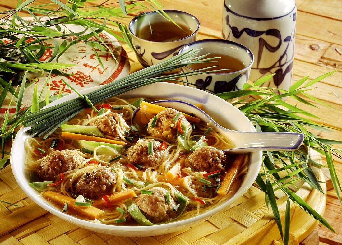 Noodle soup with meatballs and vegetables