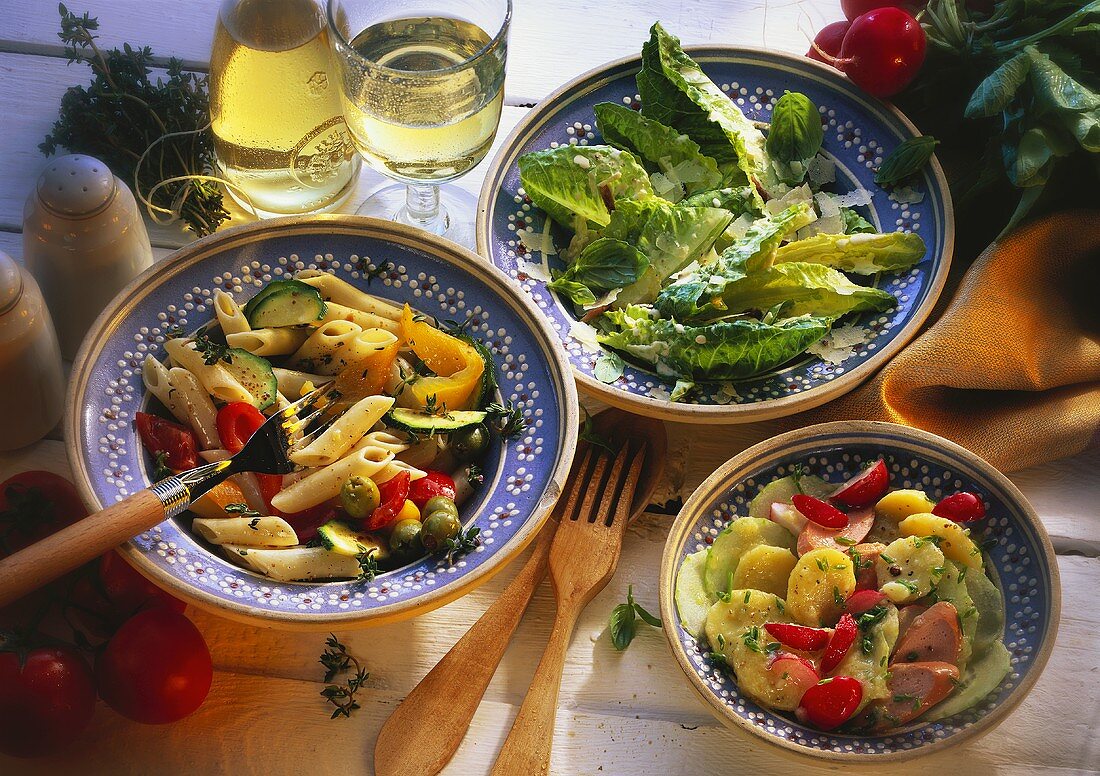 Three salads: pasta, potato and romaine