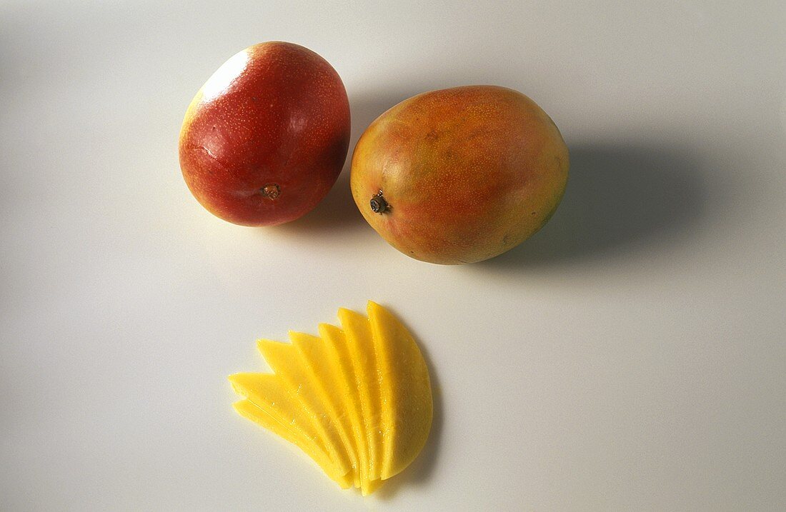 Whole mangoes and mango fan
