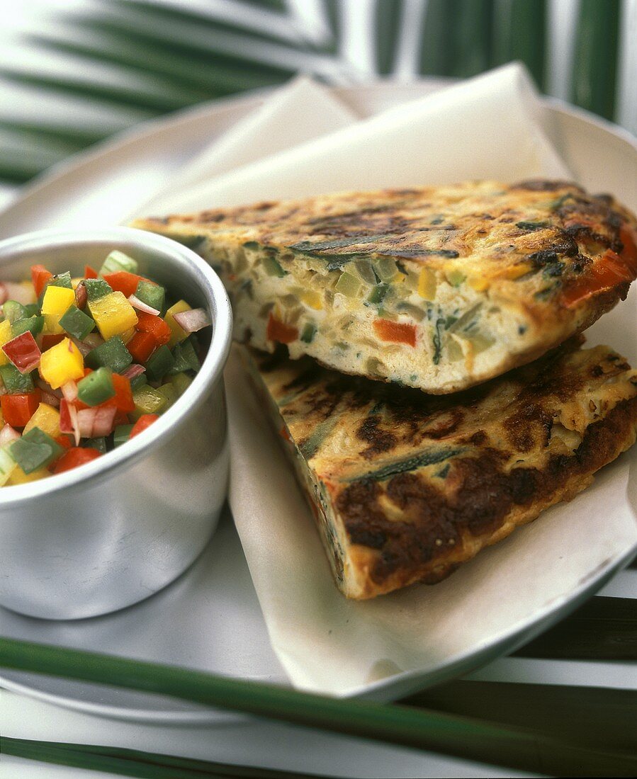 Two pieces of vegetable frittata & bowl of diced vegetables