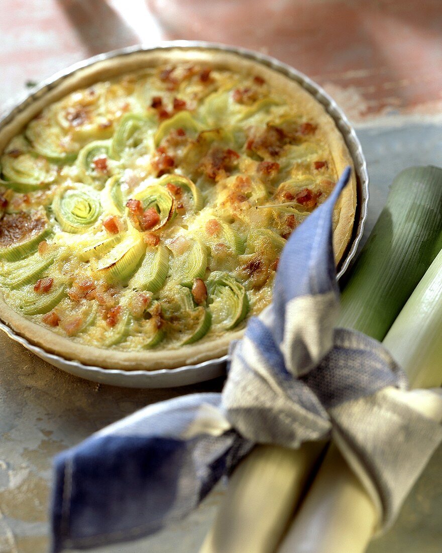 Leek quiche with bacon in quiche dish