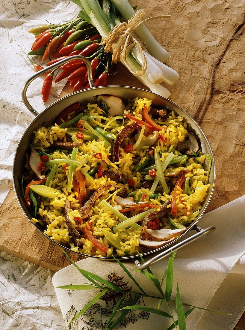 Pan-cooked rice dish with vegetables & beef strips