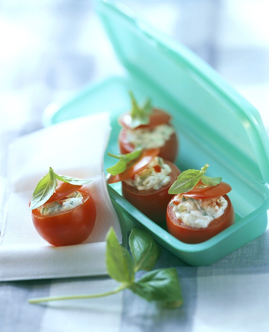 Stuffed tomatoes with olives and cream cheese and basil
