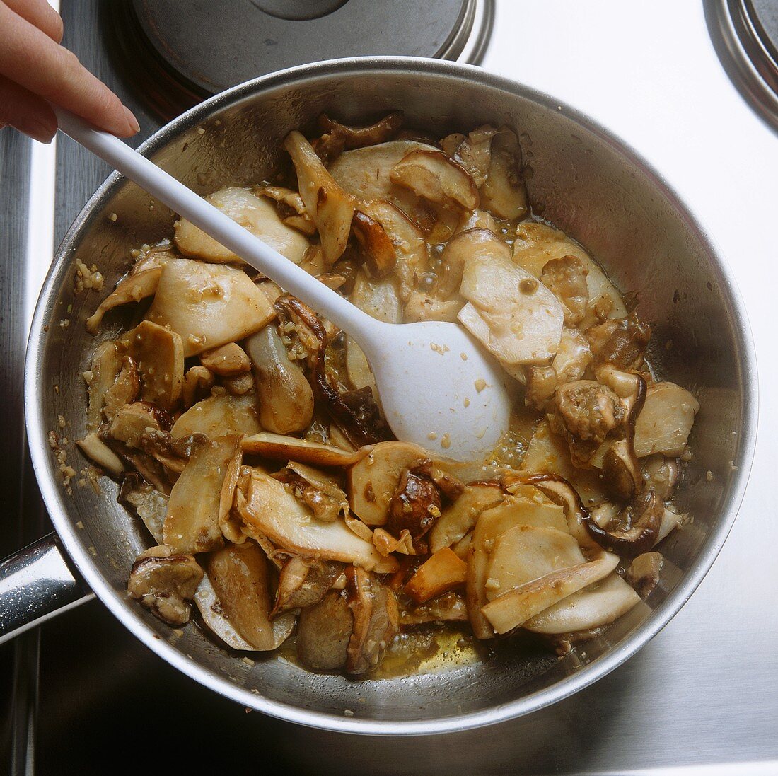 Frying mushrooms in a pan