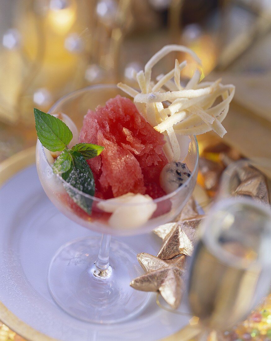 Raspberry sorbet with lychees and pitahaya in glass
